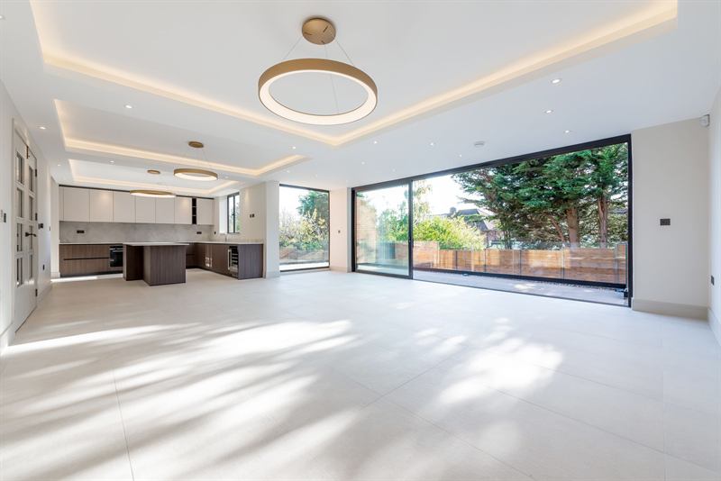 Open-plan living space with sliding doors to the garden